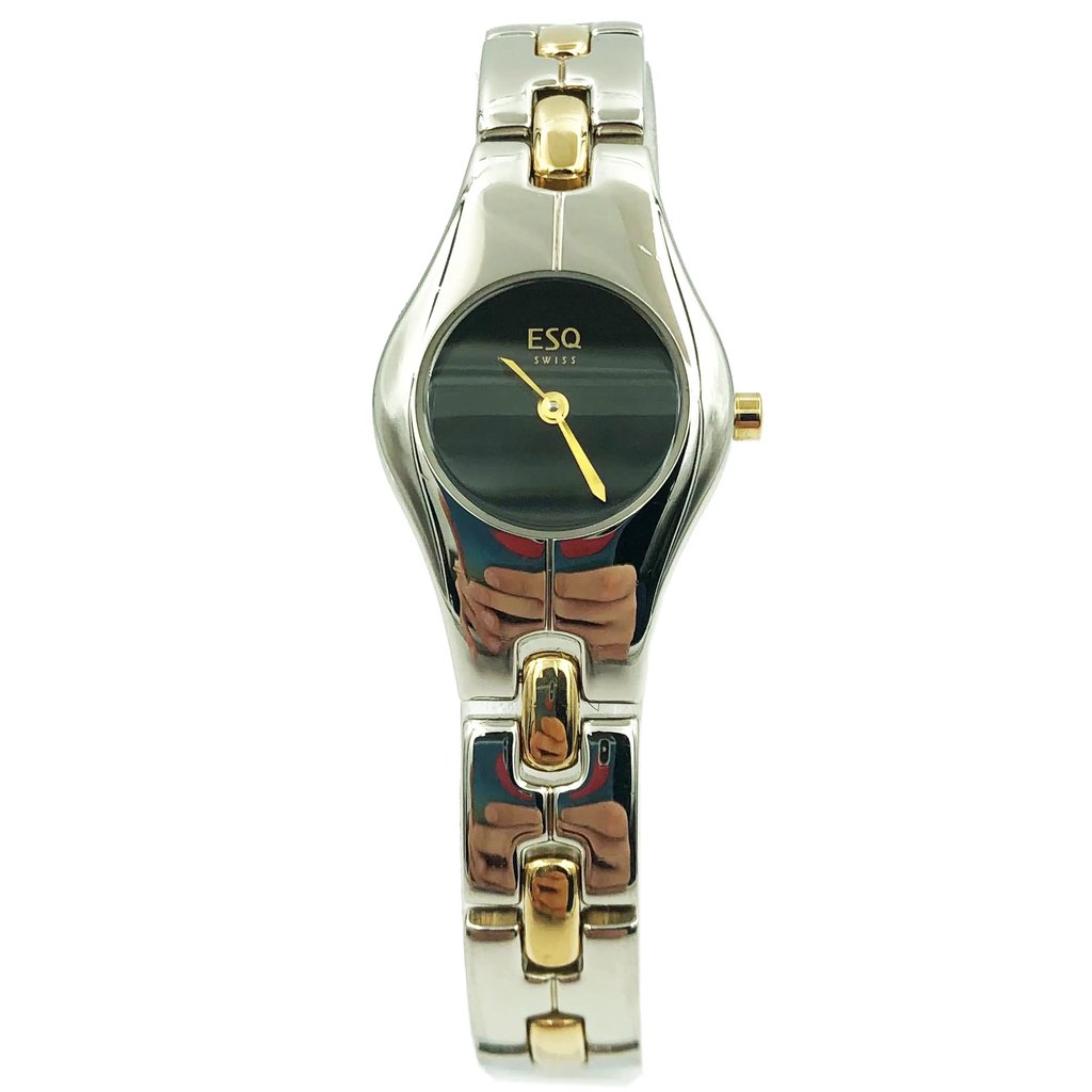 An image of a Wristwatch by ESQ. This Pre Owned item is designed for Women, featuring a Dress/Formal style. It has a Quartz movement and an Analog display with a Black dial color. The indices include No Hour Marks. The band is made of Steel and the case is made of Steel. The watch has a Round shape with a case size of 22 mm and a case thickness of 7 mm.
