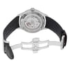 An image of a pre-owned Montblanc men's wristwatch, viewed from the back with an open clasp. The watch is positioned in the center of the frame at a slight angle, showcasing its stainless steel case back with an exhibition window revealing the internal movement. The round watch shape is apparent, with a leather band that is partially unfolded, featuring a deployant closure. The distance is close enough to capture the textured detail of the leather and the engravings on the stainless steel.