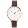 An image of a pre-owned Skagen wristwatch taken from a front-facing angle. The watch features a minimalist design with a white dial and slim black hour markers. It includes a small subdial with colorful numerals. The case has a rose-gold tone, and the watch is paired with a dark brown leather strap. The entire watch is centered in the image, captured at a close distance.