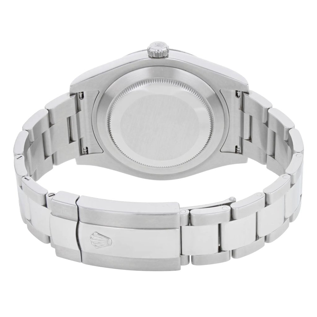 An image of a pre-owned wristwatch showing the back view, focusing on the closed clasp. The watch is positioned horizontally, with the stainless steel bracelet and clasp prominently displayed. The angle provides a clear view of the watch's case back, showcasing its circular design. The photograph is taken from a close distance, highlighting the details and finish of the metal surface.