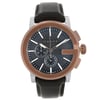 An image of a new Gucci men's wristwatch with defects, presented in a front full frontal view. The watch features a round stainless steel case with a bronze bezel and a black teaked dial. The dial includes stick indexes, a 12-hour display, a chronograph with luminous hands, and a small seconds subdial. It is fitted with a black leather band. The watch is positioned centrally and shot at a direct angle, capturing its full face with no obstructions, allowing a clear view of its details. The distance is close enough to show fine details while displaying the entire watch.