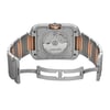 An image of a pre-owned women's Cartier wristwatch, viewed from the back at a slight angle. The watch is positioned centrally in the frame, showing the stainless steel and rose gold bracelet extended. The focus is on the transparent case back, revealing the internal mechanism with "Cartier" branding clearly visible. The watch includes a date indicator feature.