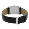 An image of a wristwatch showcasing the back view, featuring a close-up of the clasp. The watch has a rectangular case with engraved details, and a black leather strap partially visible. The image highlights the display model's polished metal and craftsmanship, with the clasp prominently in the forefront. The angle is slightly elevated, providing a clear view of the watch's back and clasp from a short distance.