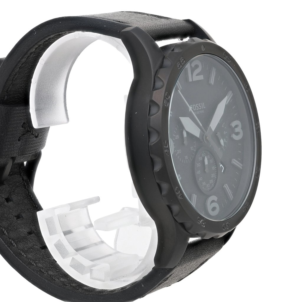 An image of a Fossil wristwatch taken from a slightly angled side view, showcasing the watch face and part of the strap. The watch is positioned close-up, highlighting its black bezel and large, easy-to-read numbers. The strap appears to be made of black leather, and the watch is new with defects. The face of the watch includes multiple dials and a date display.