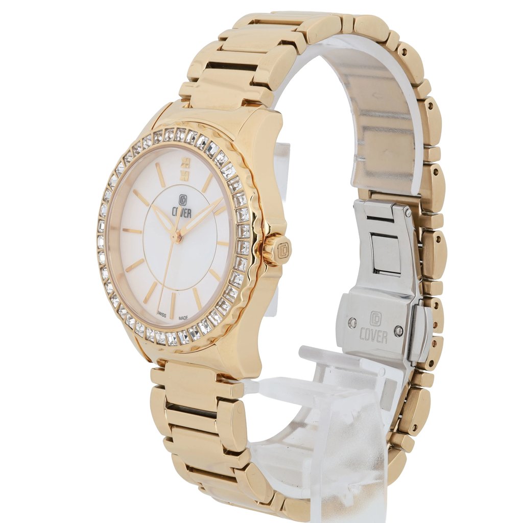 An image of a pre-owned COVER women's wristwatch featuring a gold-tone metal band and a round face. The watch is positioned at a slight angle, showcasing the luminous hands and the bezel adorned with crystals. The shot is taken from a close distance, highlighting the intricate details on the band and clasp.
