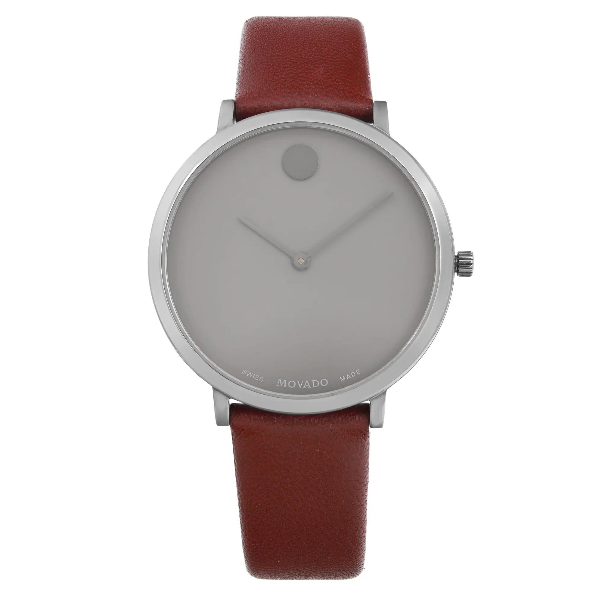 An image of a pre-owned wristwatch viewed from a front full frontal angle. The watch features a minimalist design with a round silver case and a smooth, brown leather strap. The dial is simple and unadorned, except for a small dot at the 12 o'clock position and minimalistic hands. The brand name "Movado" is visible at the bottom of the dial. The watch is positioned centrally in the frame, captured at a close distance.