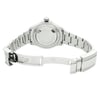 An image of a pre-owned wristwatch showing the back view with the clasp open. The watch is positioned at eye level, capturing a straight-on angle. The focus is on the stainless steel bracelet and the back case, emphasizing the intricate details and markings. The image is taken from a medium distance, highlighting the craftsmanship of the watch.