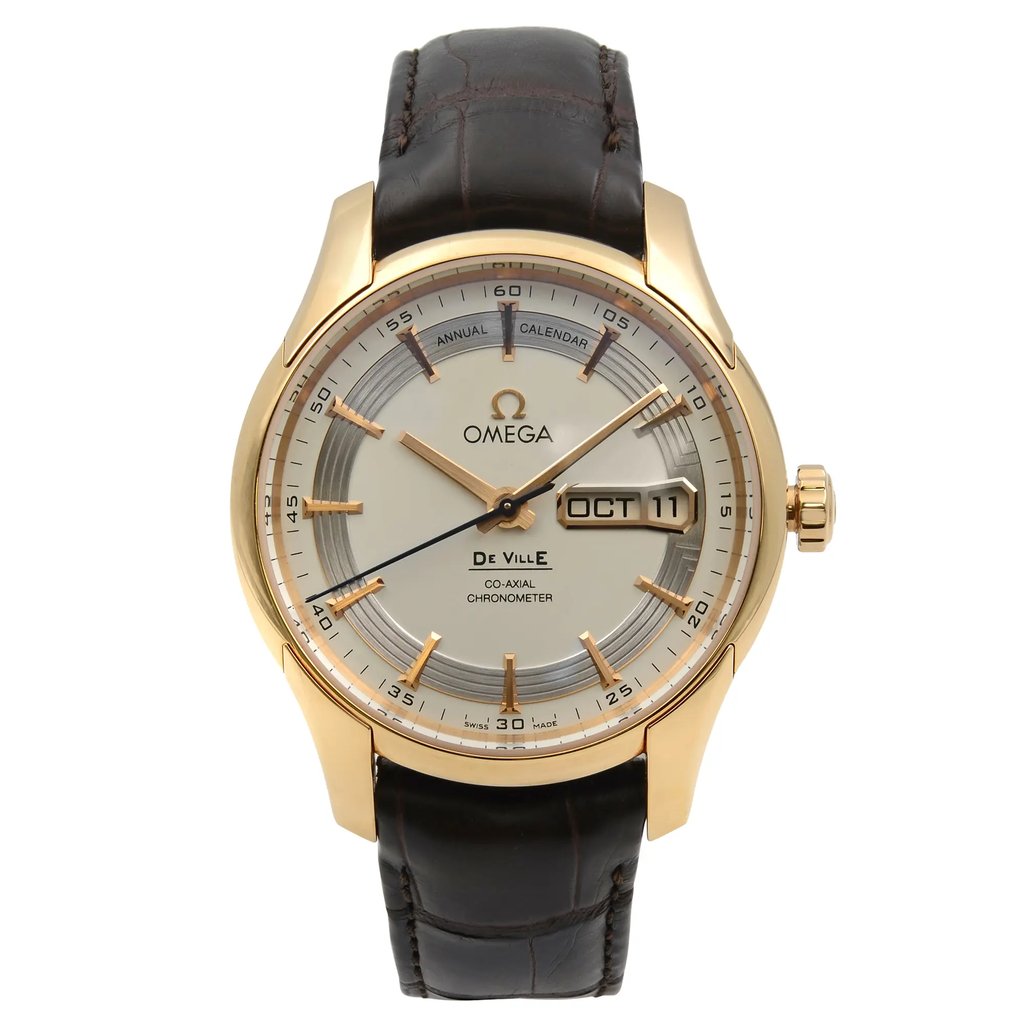 An image of a Wristwatch by OMEGA. This Pre Owned item is designed for Men, featuring a Dress/Formal,Luxury style. It has a Mechanical (Automatic) movement and an Analog display with a Silver dial color. The indices include Non-Numeric Hour Marks,Seconds Hand. The band is made of Leather and the case is made of Rose Gold. The watch has a Round shape with a case size of 40.5 mm and a case thickness of 14 mm.
