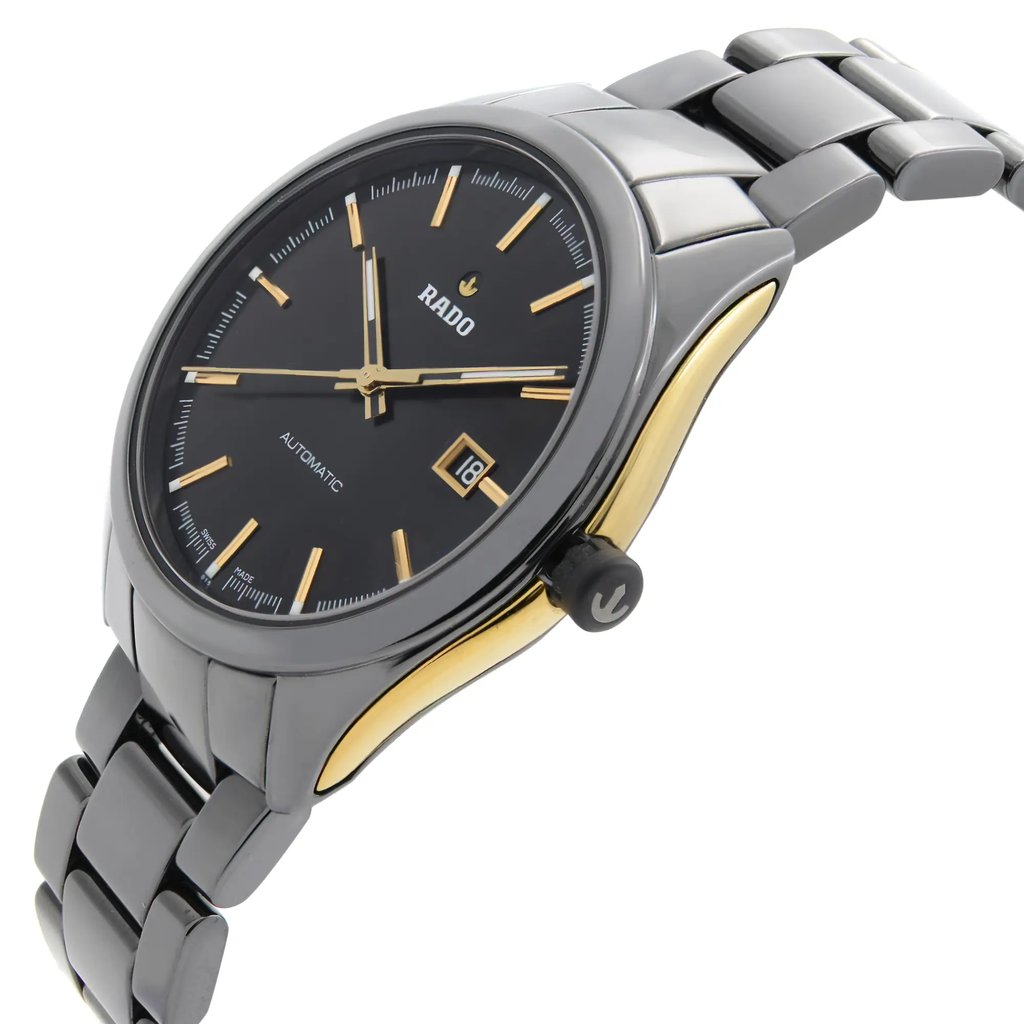 An image of a pre-owned wristwatch shown from a side profile view. The watch features a visible crown on the right side. It has a black dial with gold hour markers and hands, and a date window at the 3 o'clock position. The case is highlighted with gold accents, and the metal bracelet is visible, angled slightly upwards. The photograph is taken from a close angle, emphasizing the watch's sleek design.