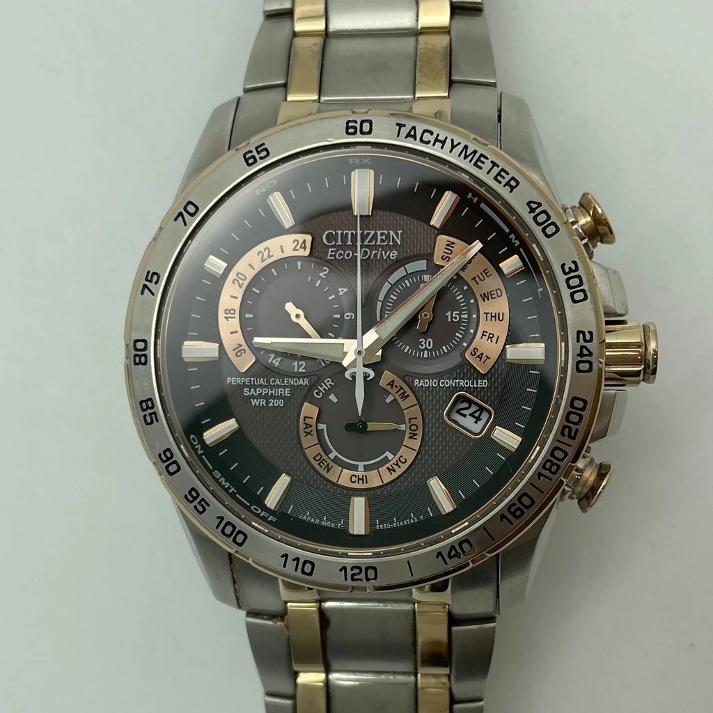 An image of a Wristwatch by Citizen. This Pre Owned item is designed for Men, featuring a Sport style. It has a Quartz movement and an Analog display with a Silver dial color. The indices include 12-Hour Dial,Multi Dial,Non-Numeric Hour Marks. The band is made of Stainless Steel and the case is made of Stainless Steel. The watch has a Round shape with a case size of 43 mm and a case thickness of 13 mm.
