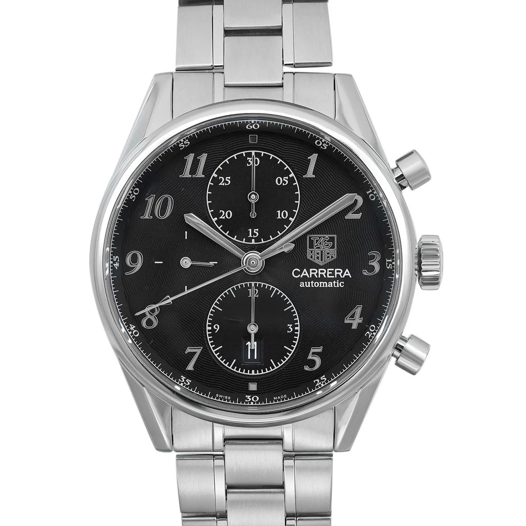 An image of a pre-owned TAG Heuer Carrera wristwatch for men, showcasing a front close-up view of the watch face. The photo is taken from a straight-on angle that clearly displays the round, black dial with gray bezel and stainless steel case. The wristwatch features a 12-hour dial with Arabic numerals, a date indicator at the 6 o'clock position, and chronograph functionality with small seconds subdial. The stainless steel band is visible with a focus on the central part of the watch, indicating a casual style. The watch appears in good condition with possible minor blemishes from handling and shipping.