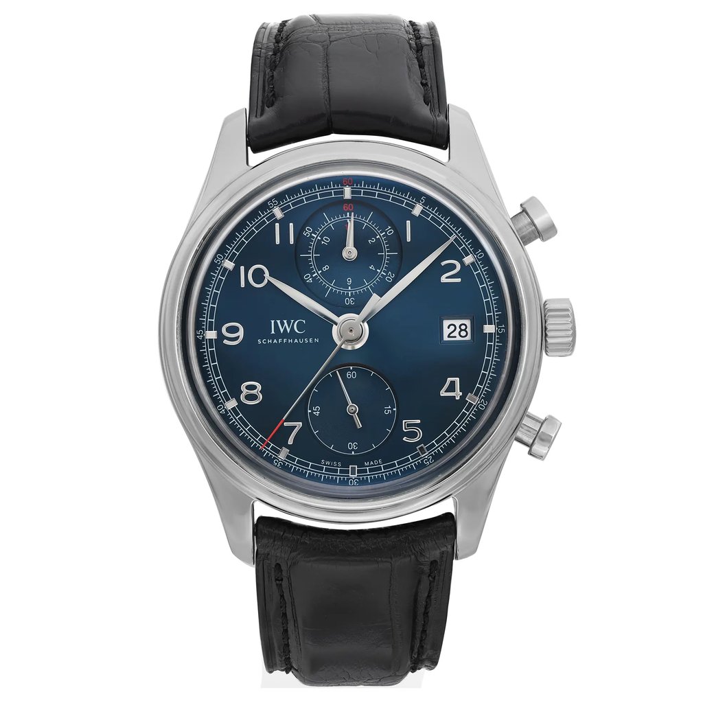 An image of a pre-owned IWC men's pilot/aviator wristwatch presented in a front full frontal view. The watch features a round stainless steel case with a gray bezel and a blue sunburst dial. It has Arabic numeral indices for a 12-hour display and a date window at the 3 o'clock position. The watch is attached to a black leather strap, and the overall condition of the watch is classified as excellent. The watch is centered in the frame, with the face occupying most of the image, and is shown at a close distance to highlight details.