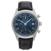 An image of a pre-owned IWC men's pilot/aviator wristwatch presented in a front full frontal view. The watch features a round stainless steel case with a gray bezel and a blue sunburst dial. It has Arabic numeral indices for a 12-hour display and a date window at the 3 o'clock position. The watch is attached to a black leather strap, and the overall condition of the watch is classified as excellent. The watch is centered in the frame, with the face occupying most of the image, and is shown at a close distance to highlight details.