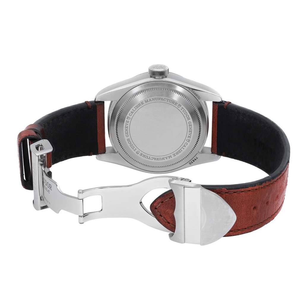 An image of a Wristwatch by TUDOR. This Pre Owned item is designed for Men, featuring a Luxury style. It has a Mechanical (Automatic) movement and an Analog display with a Black dial color. The indices include 12-Hour Dial,Round Indexes. The band is made of Leather and the case is made of Stainless Steel. The watch has a Round shape with a case size of 41 mm and a case thickness of 15 mm.
