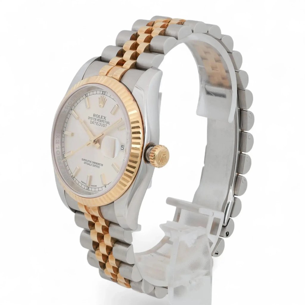 An image of a pre-owned men's Rolex wristwatch, positioned at a slight angle from the right side, capturing the face and part of the bracelet. The watch features a silver dial with a date indicator and luminous hands. The two-tone bracelet consists of gold and stainless steel links. The image is taken at a close distance, highlighting the watch's detailed craftsmanship.