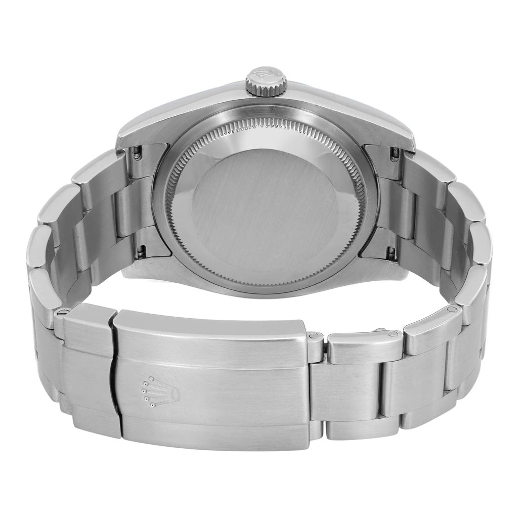 An image of a pre-owned wristwatch viewed from the back, showing a close-up of the closed clasp. The watch is positioned upright, highlighting its metallic bracelet and the smooth, round case back. The angle provides a clear view of the clasp, which features an engraved logo. The photo is taken at a close distance, emphasizing the brushed metal texture and details of the watch's construction.