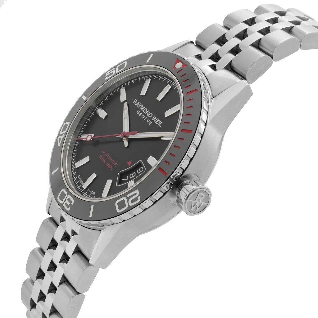 An image of an unworn RAYMOND WEIL men's wristwatch positioned at a 45-degree angle to give a clear view of the dial and part of the stainless steel bracelet. The watch features a round case with a black dial, stick hour markers, and a date window at the 4 o'clock position. The bezel is stainless steel with black and red accents, and the hands are slender and silver-toned with a red second hand. The stainless steel bracelet has a woven design, and the RAYMOND WEIL logo is visible on the crown, which is shown in profile. The overall distance from the camera gives a full view of the watch face and a partial view of the bracelet.