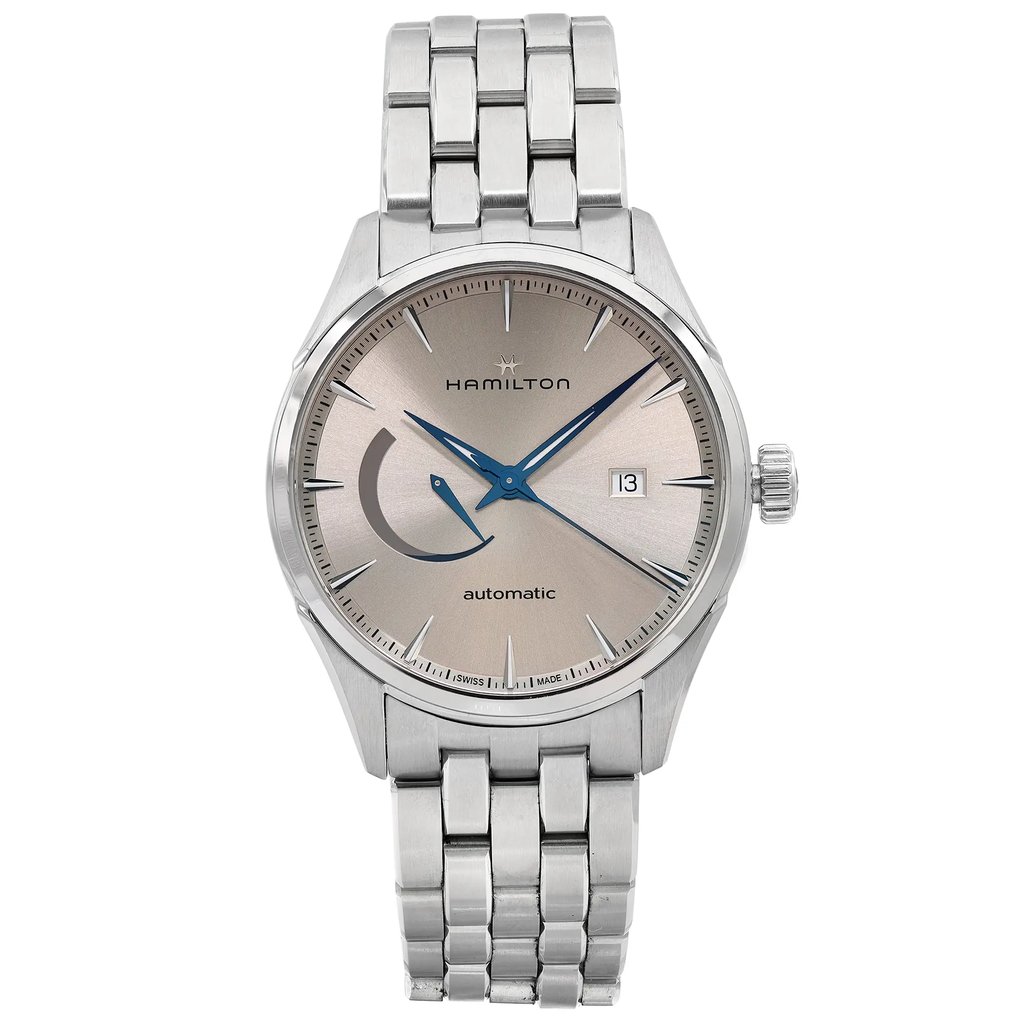 An image of a pre-owned wristwatch shown from a front full frontal view. The watch features a stainless steel bracelet and a round silver dial with blue hands and a date display. The brand name is visible on the dial. The photograph is taken at a close distance, highlighting the watch's details and condition.