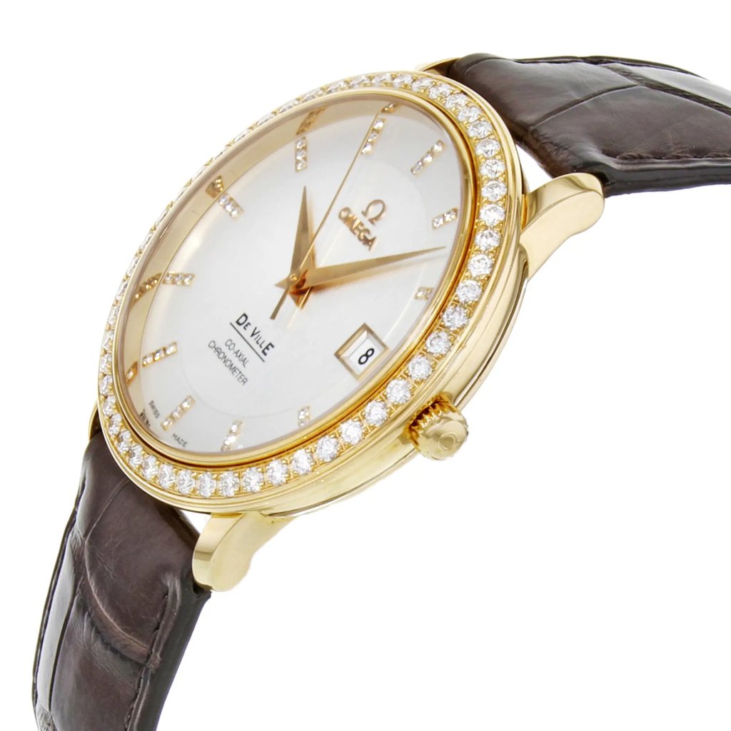 An image of a men's Omega wristwatch, positioned at a slight angle from the right side, showcasing its elegant design. The watch features a rose gold case with a diamond-studded bezel and a silver dial. The brown leather strap is visible, adding a classic touch. The image captures the watch from a close distance, highlighting the intricate details and craftsmanship.