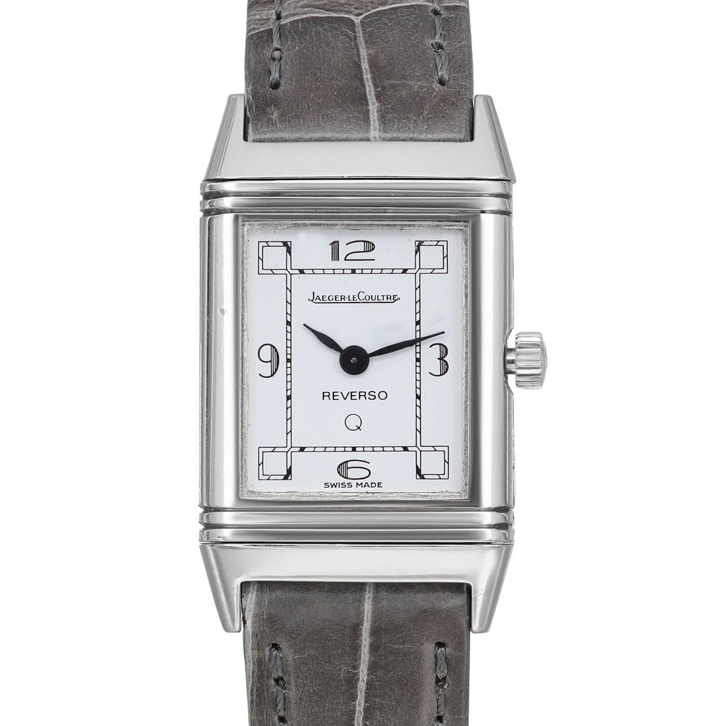 An image of a pre-owned wristwatch taken from a front close-up angle, showcasing the rectangular watch face. The timepiece features a white dial with black numerals at the 12, 3, 6, and 9 o'clock positions. It has black hour and minute hands. The watch is encased in a polished metal frame and is attached to a textured gray strap. The crown is visible on the right side.