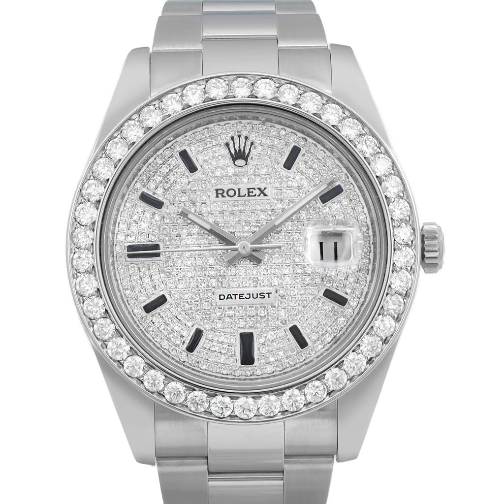 An image of a pre-owned wristwatch taken from a front close-up angle, focusing on the watch face. The watch features a silver-tone dial adorned with diamonds, surrounded by a diamond-studded bezel. The brand name is visible on the dial, and the time is displayed with silver hour markers and hands. The bracelet is metallic, complementing the luxurious design.