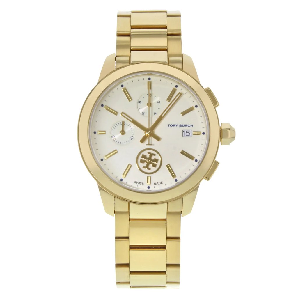 An image of a Wristwatch by Tory Burch. This Pre Owned item is designed for Women, featuring a Casual style. It has a Quartz movement and an Analog display with a Cream dial color. The indices include Sticks. The band is made of Stainless Steel and the case is made of Stainless Steel. The watch has a Round shape with a case size of 38 mm and a case thickness of 11 mm.