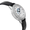 An image of a pre-owned Montblanc women's luxury wristwatch, presented in a side profile view from the angle opposite the crown. The watch features a round stainless steel case with a gray bezel adorned with diamonds. It has a silver dial with black numerals and blue hands and includes a day/night indicator. The timepiece is completed with a black leather band, and the image is taken from a close distance to show detail.