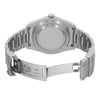 An image of a pre-owned wristwatch showcasing the back view with an open clasp. The watch is positioned centrally, with the bracelet extending outward. The angle reveals the back casing and the inner side of the clasp, highlighting engraved details. The photo is taken from a close distance, focusing on the watch's metallic finish and craftsmanship.