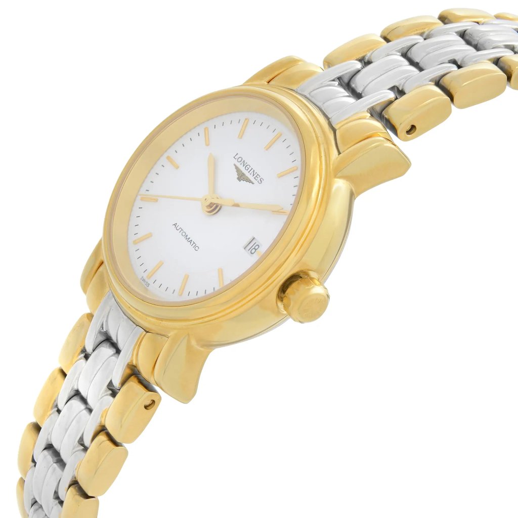 An image of a wristwatch taken from a side profile view, showcasing the crown prominently. The watch is positioned at a slight angle, highlighting its metallic band and the smooth curves of the case. It is a display model in pristine condition, with the face and details clearly visible.