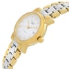 An image of a wristwatch taken from a side profile view, showcasing the crown prominently. The watch is positioned at a slight angle, highlighting its metallic band and the smooth curves of the case. It is a display model in pristine condition, with the face and details clearly visible.