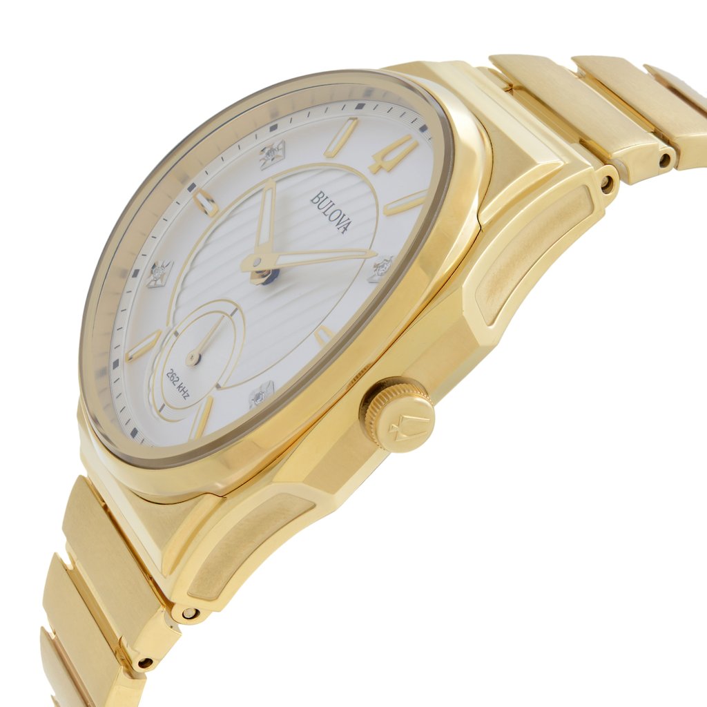 An image of a new but defective Bulova women's dress wristwatch in a close-up side profile view with the crown visible. The watch features a gold-tone stainless steel case and band, a round shape, and a silver dial with luminous hands. The bezel is also gold-tone, complementing the overall formal style.