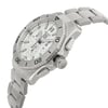 An image of a TAG Heuer men's wristwatch in unworn condition, displayed at a close distance with a side profile view that highlights the crown. The watch features a round stainless steel case and band, with a silver dial and gray bezel. It is designed in a casual style and includes a chronograph, date indicator, and a small seconds subdial. The angle of the photo shows the wristwatch slightly tilted, allowing the features on the face and side, including the crown and pushers, to be visible.