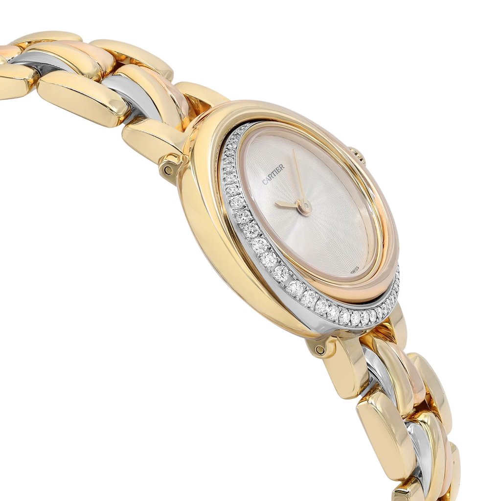 An image of a pre-owned Cartier luxury wristwatch for women, presented in a side profile view opposite the crown. The watch, captured at a close distance and angled to show the side and part of the watch face, features a round shape with a white dial pattern. It has a gold bezel adorned with diamonds, and the band is made of intertwined links of rose gold, white gold, and yellow gold. The case material matches the band, providing an elegant contrast of colors and finishes.