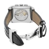 An image of a pre-owned wristwatch captured from the back view, showcasing its open clasp. The watch is positioned centrally, with a slight angle to highlight the transparent case back and visible mechanical movement. The clasp is open, allowing a clear view of the black leather strap's texture and the metal components. The image is taken from a moderate distance, focusing on the intricate details.