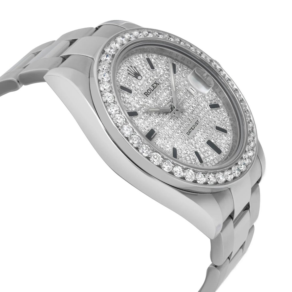 An image of a pre-owned wristwatch viewed from the side profile, opposite the crown. The watch is positioned at a slight angle, showcasing the bracelet and the diamond-encrusted bezel and face. The image is taken from a moderate distance, capturing the detailed embellishments and the watch's sleek design.