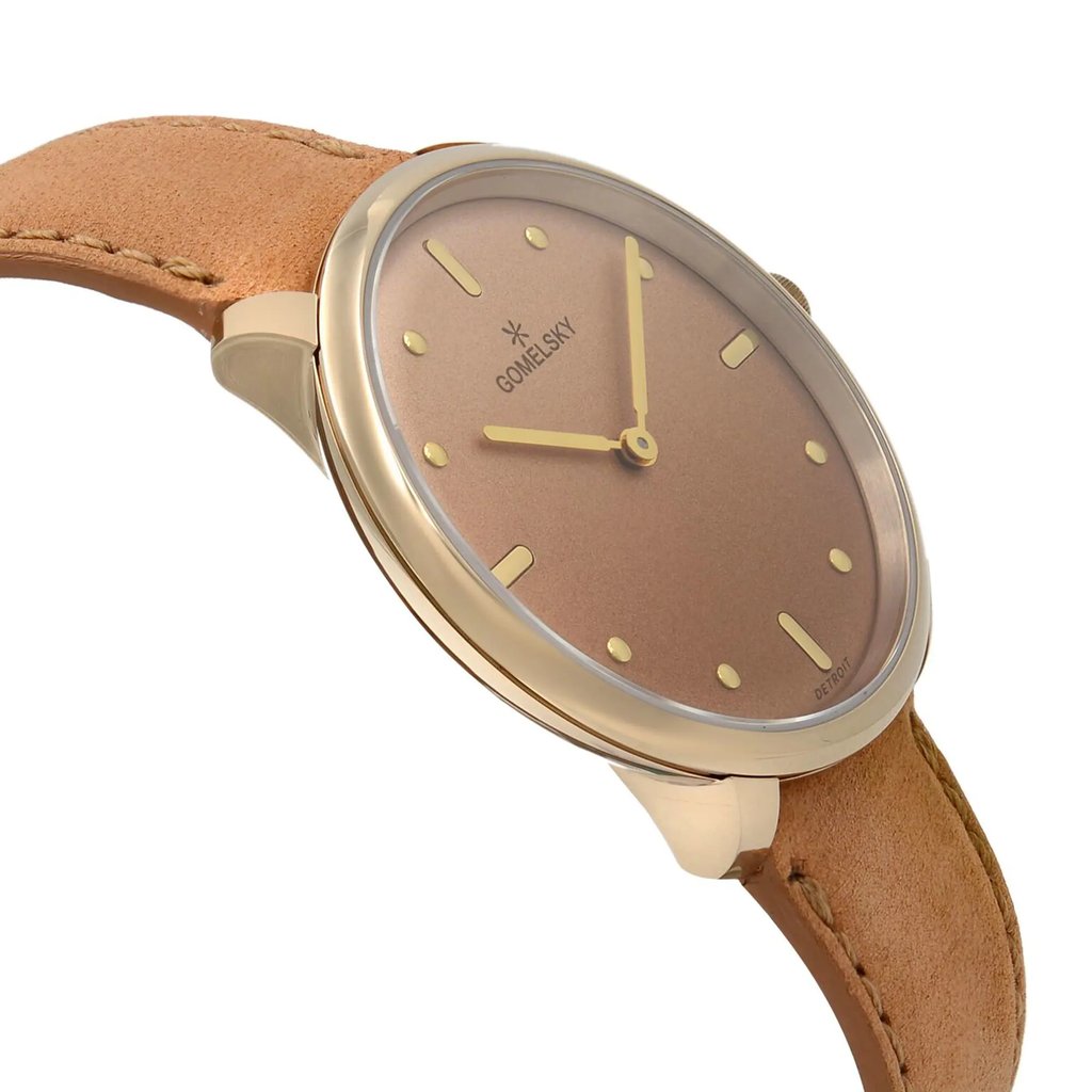An image of a wristwatch taken from a side profile view, opposite the crown. The watch is unworn and features a sleek design with a brown dial and gold-toned markers and hands. It has a light brown leather strap, visible in the foreground, adding a classic touch. The angle highlights the watch's slim profile, with a clear view of the case's smooth edges. The image is taken from a close distance, emphasizing the watch's elegant details.