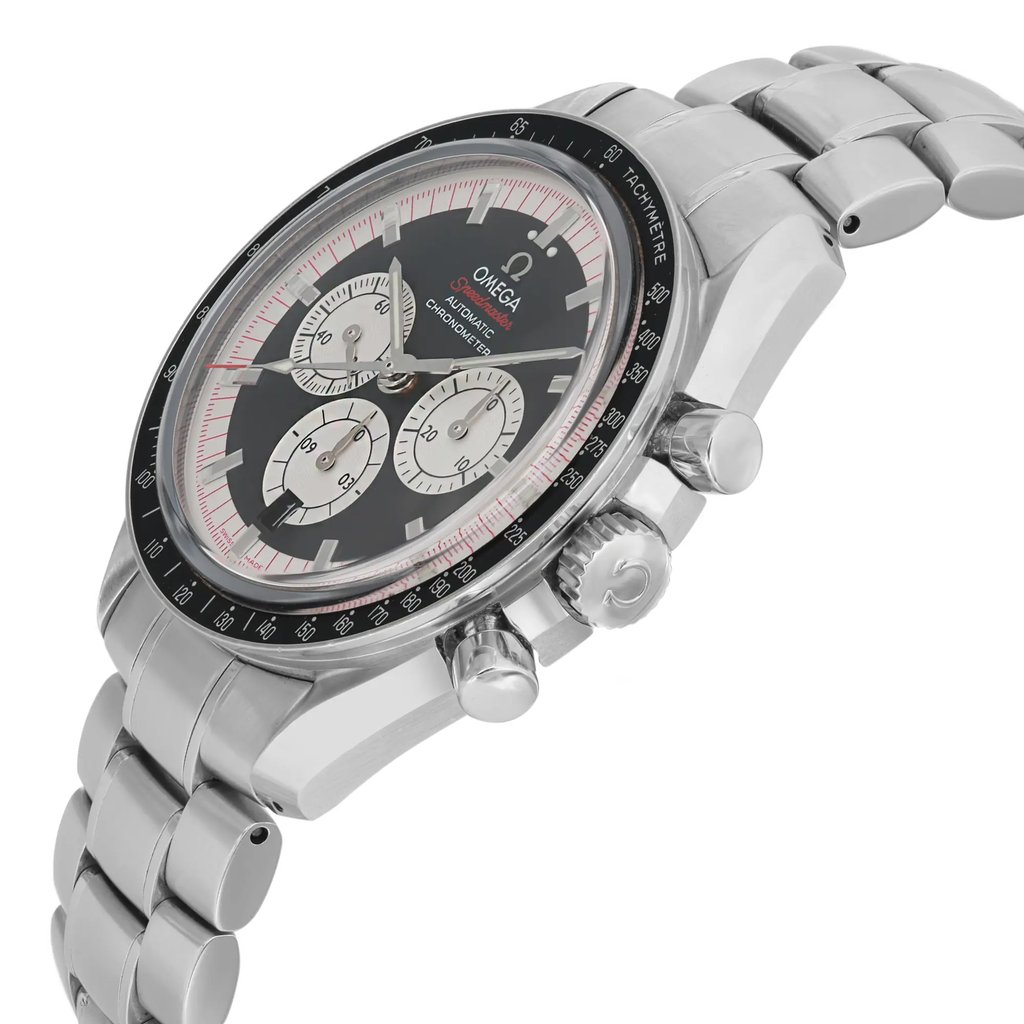 An image of a pre-owned wristwatch shown from a side profile view. The watch features a metallic bracelet and the crown is prominently displayed. The face of the watch includes three subdials and a tachymeter scale on the bezel. The angle highlights the watch's thickness and detail on the side.