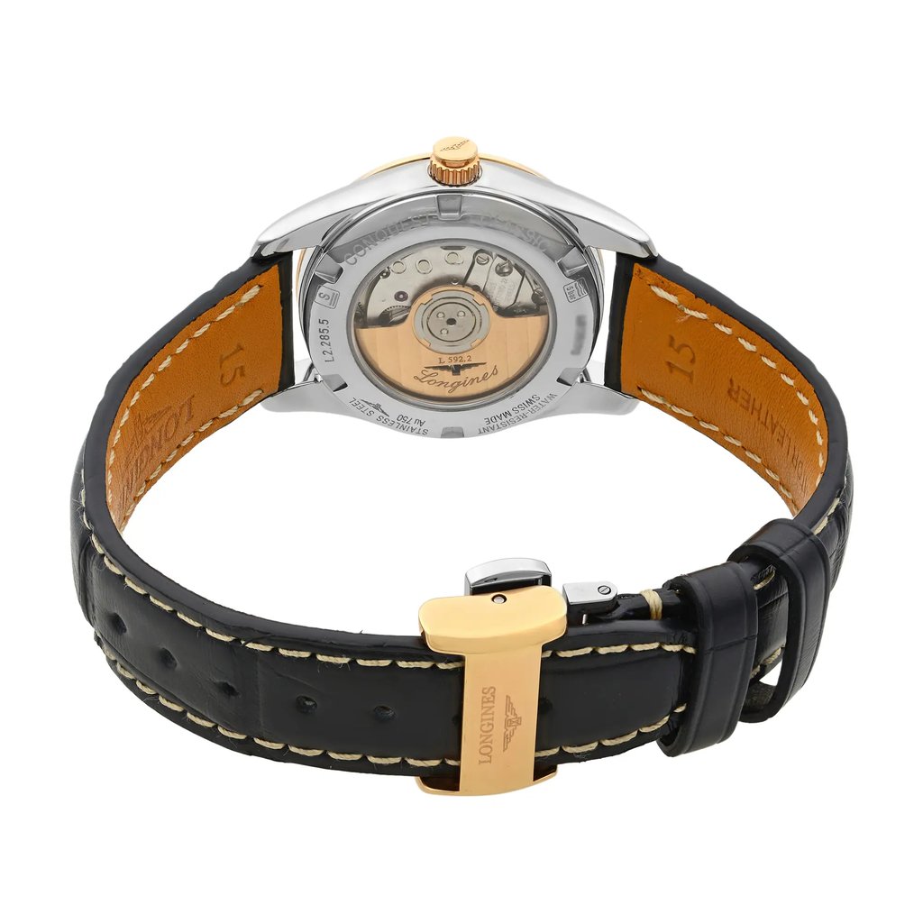 An image of a wristwatch taken from the back view, showcasing the close clasp. The watch features a transparent case back revealing its intricate mechanical movement. The leather strap is black with beige stitching, and the clasp is gold-toned. The angle is straight-on from a moderate distance, highlighting the craftsmanship and design details.