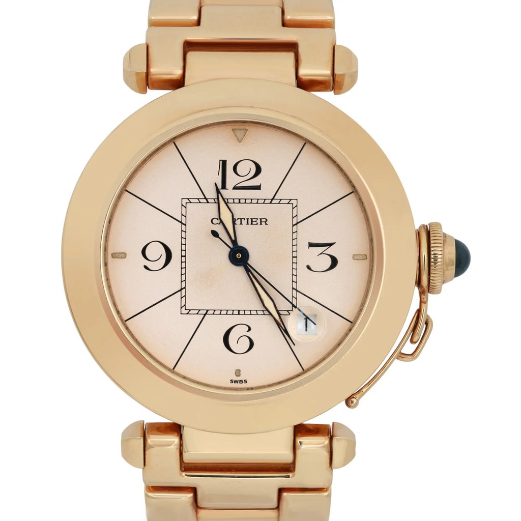 An image of a pre-owned men's Cartier wristwatch, positioned upright and viewed from the front at a close distance. The watch features a round gold case with a date indicator and luminous hands, and has a prominent crown on the right side. The bracelet is also gold, complementing the watch's elegant design.