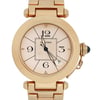An image of a pre-owned men's Cartier wristwatch, positioned upright and viewed from the front at a close distance. The watch features a round gold case with a date indicator and luminous hands, and has a prominent crown on the right side. The bracelet is also gold, complementing the watch's elegant design.
