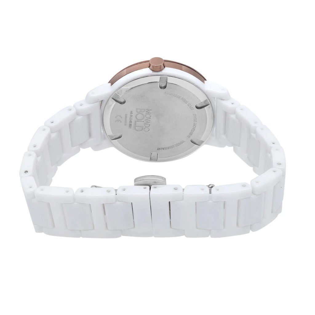 An image of a wristwatch taken from the back view, showcasing the closed clasp. The watch band is white, and the case back is visible, featuring engraved details. The watch is positioned upright and photographed from a close angle, highlighting its new condition with defects.