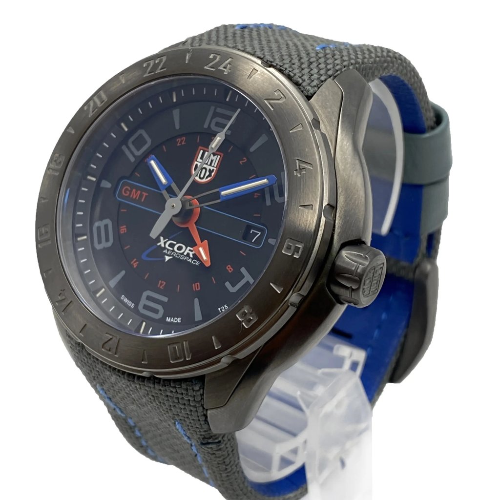 An image of a Wristwatch by Luminox. This Pre Owned item is designed for Men, featuring a Pilot/Aviator style. It has a Quartz movement and an Analog display with a Black dial color. The indices include 12-Hour Dial,24-Hour Dial,Arabic Numerals,Stick Indexes. The band is made of Nylon and the case is made of Stainless Steel. The watch has a Round shape with a case size of 45.5 mm and a case thickness of 15 mm.