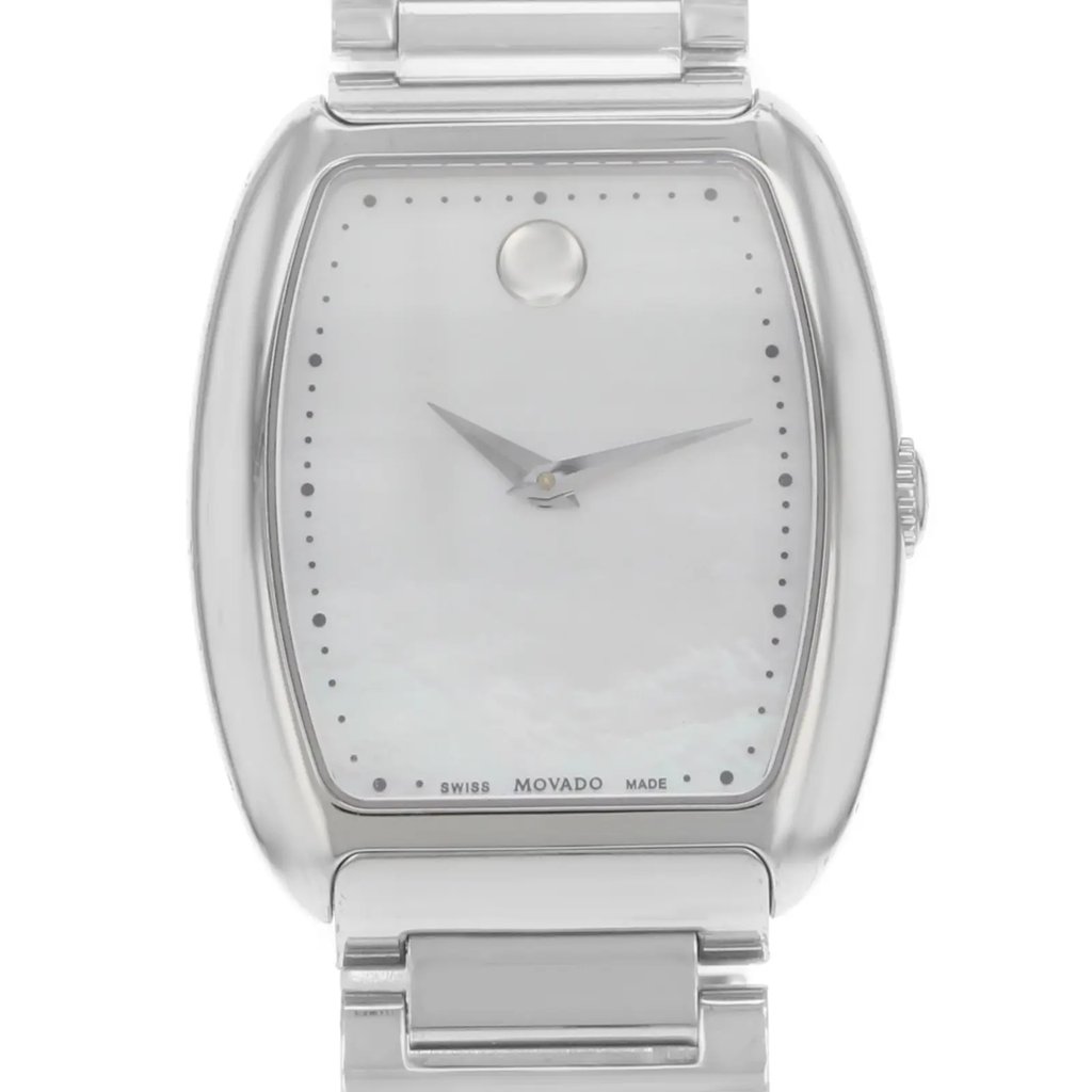 An image of a pre-owned wristwatch shown from a front close-up angle, focusing on the watch face. The watch features a minimalist design with a silver frame and a simple dial, with small dot markers around the edge and a single circular mark at the 12 o'clock position. The watch hands are sleek and silver, providing a clean and elegant appearance. The brand name is subtly visible at the bottom of the face. The stainless steel bracelet is partially visible at the top and bottom, emphasizing the watch's polished finish.