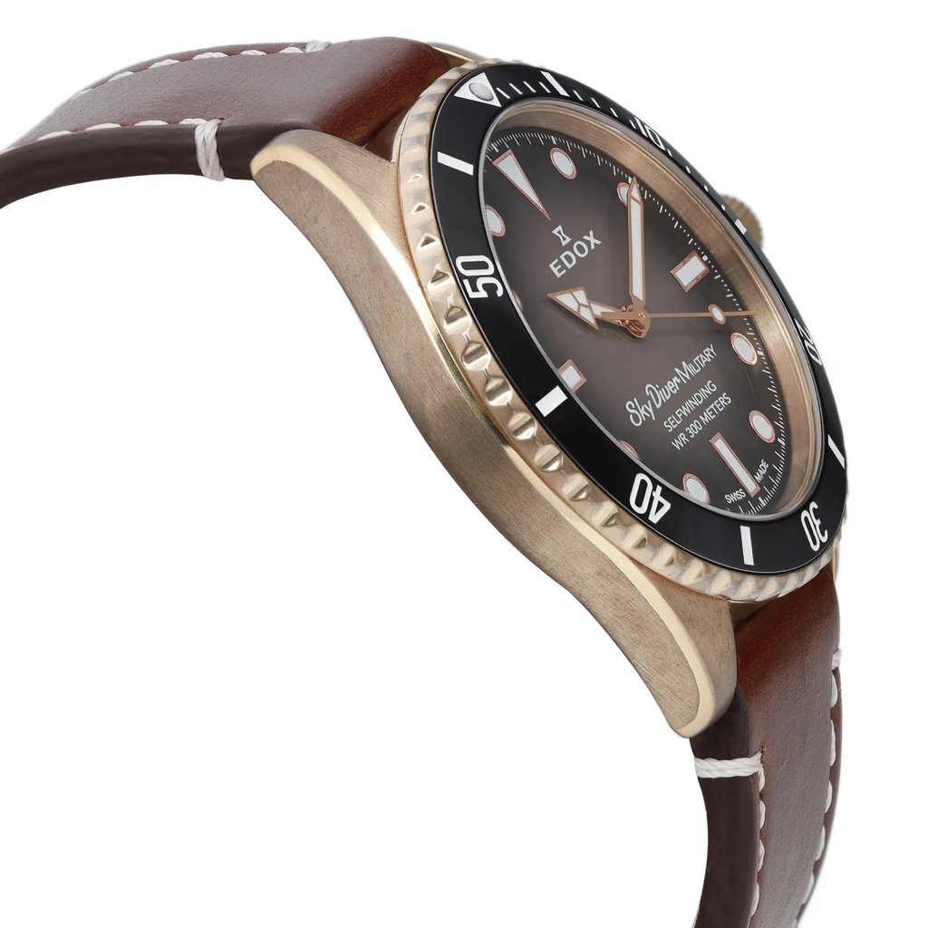 An image of a Wristwatch by Edox. This Pre Owned item is designed for Men, featuring a Casual style. It has a Mechanical (Automatic) movement and an Analog display with a Black gradient dial color. The indices include 12-Hour Dial,Round Indexes,Stick Indexes. The band is made of Leather and the case is made of Bronze. The watch has a Round shape with a case size of 42 mm and a case thickness of 12 mm.
