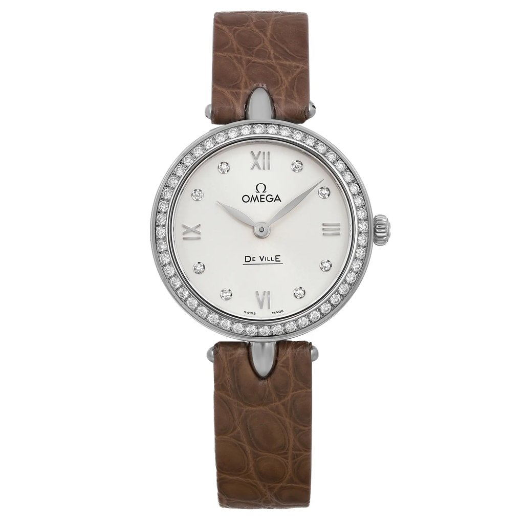 An image of a front full frontal view of a display model OMEGA wristwatch for women in a casual style. The watch features a silver dial with diamond markers at each hour position and Roman numerals at the 12, 3, 6, and 9 o'clock positions. The round case is made of stainless steel with a gray bezel adorned with multiple small diamonds. The band is crafted from brown leather with a visible textured pattern. The watch is positioned centrally in the frame, with the band partially folded behind the watch, allowing a clear view of the dial and case from a direct angle and close distance.