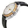 An image of a pre-owned Breitling men's wristwatch in a casual style, captured from a side profile angle highlighting the crown. The watch features a round stainless steel case with a gold bezel showing minor nicks. The white dial includes subdials and a date function. The black rubber band displays signs of wear. The image is taken from a close distance with a focus on the side of the watch facing slightly upwards.