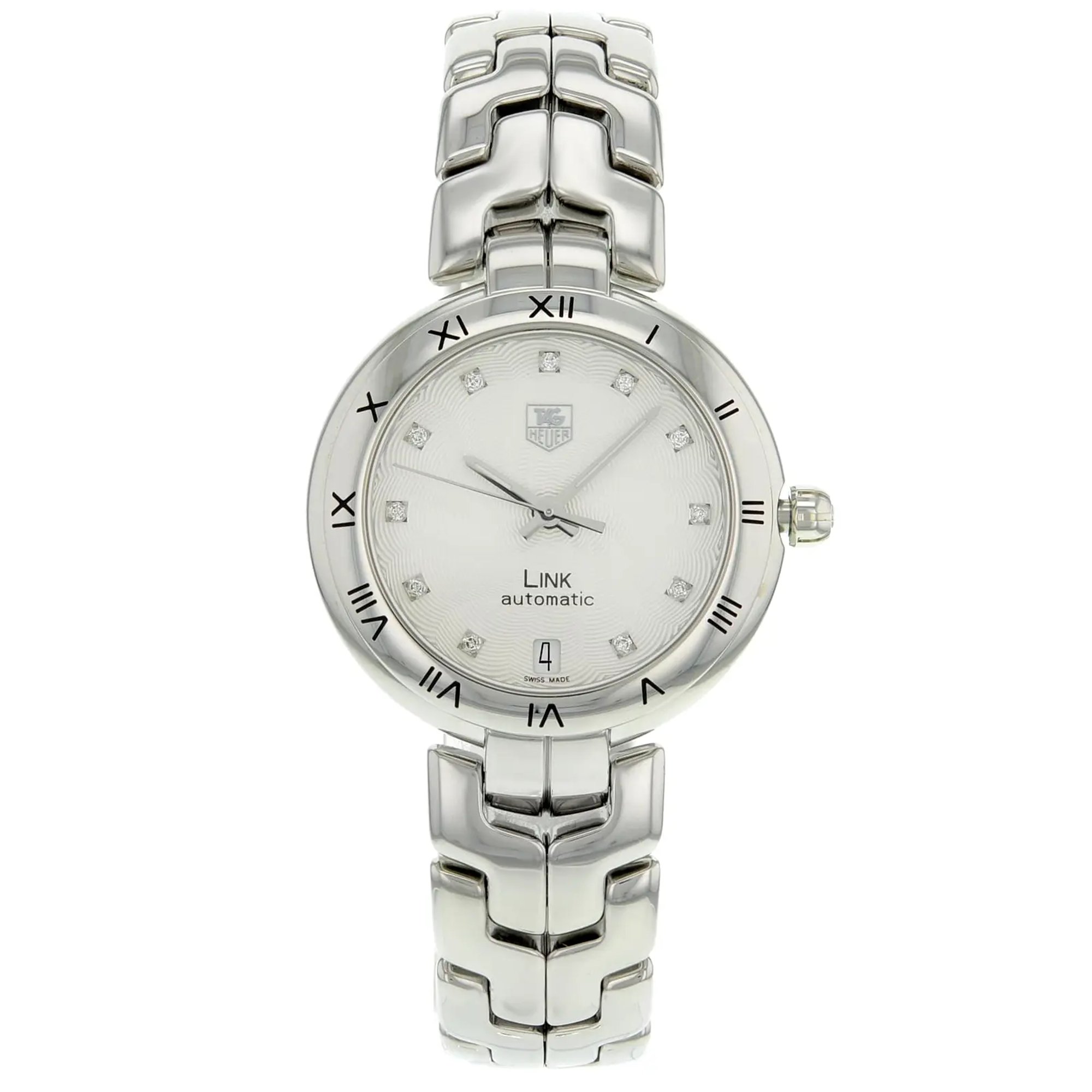 An image of a Wristwatch by TAG Heuer. This Pre Owned item is designed for Women, featuring a Dress/Formal style. It has a Mechanical (Automatic) movement and an Analog display with a Silver dial color. The indices include 12-Hour Dial,Diamond Markers. The band is made of Stainless Steel and the case is made of Stainless Steel. The watch has a Round shape with a case size of 34 mm and a case thickness of 10 mm.