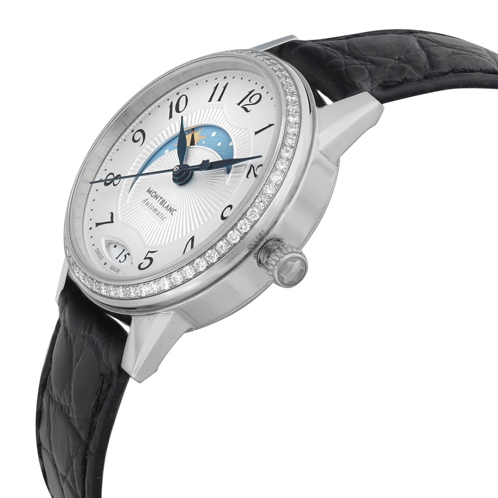 An image of a pre-owned Montblanc luxury wristwatch for women, showcased from a side profile angle where the crown is visible. The watch features a round stainless steel case with a gray bezel adorned with diamonds and a silver dial. It has a day/night indicator in the middle of the dial. The band is made of black leather with a textured finish, and the image is taken from a close distance, clearly displaying the details and craftsmanship of the watch.