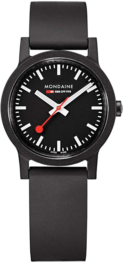 An image of a Wristwatch by Mondaine. This Display Model item is designed for Women, featuring a Casual style. It has a Quartz movement and an Analog display with a Black dial color. The indices include 12-Hour Dial,Non-Numeric Hour Marks,Stick Indexes. The band is made of Rubber and the case is made of Black renewable raw material. The watch has a Round shape with a case size of 32 mm and a case thickness of 8 mm.