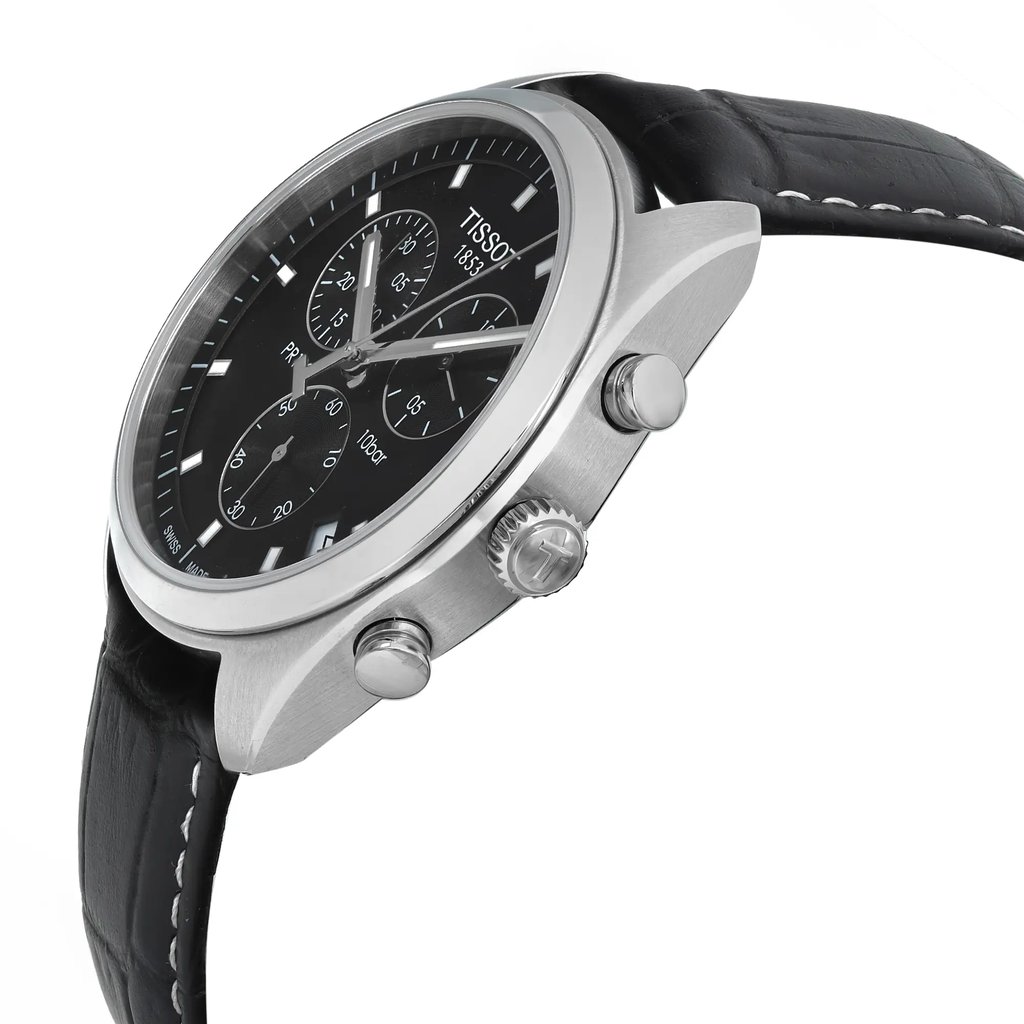 An image of a Wristwatch by Tissot. This Display Model item is designed for Men, featuring a Casual style. It has a Quartz movement and an Analog display with a Black dial color. The indices include 12-Hour Dial,Baton Indexes. The band is made of Leather and the case is made of Stainless Steel. The watch has a Round shape with a case size of 41 mm and a case thickness of 11 mm.